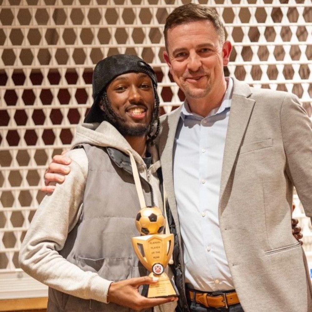 Liban Ibrahim receiving his award at Paulton Rovers