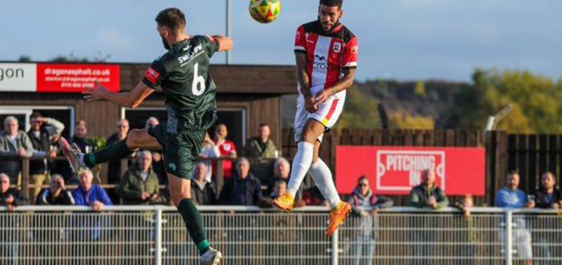 Remaye Campbell heads Ilkeston's third goal 