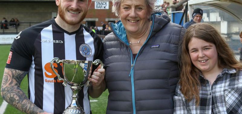 Charlie Gunson receiving his award from Annie Greenslade