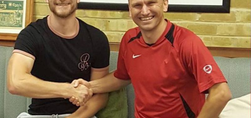 Adam Learoyd signs